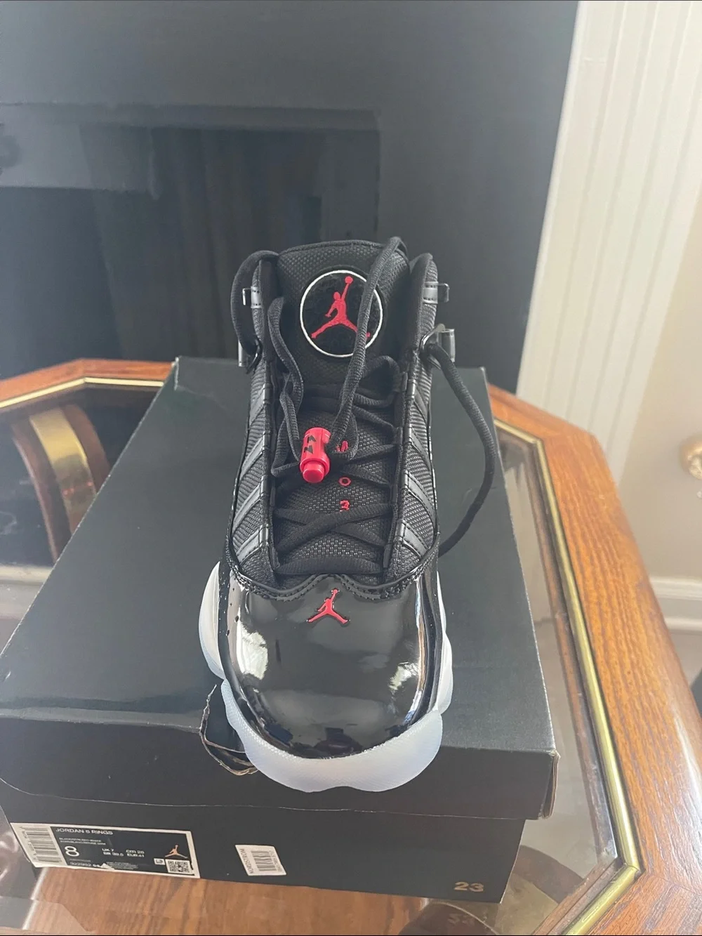 Jordan men’sHigh-Top Sneakers in Black with Red Accents